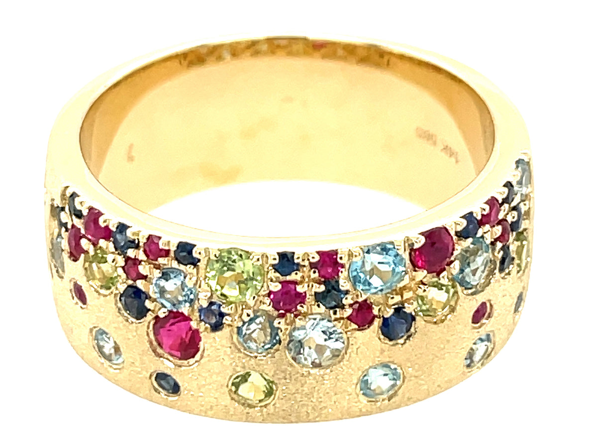 RUBY, BLUE SAPPHIRE, PERIDOT, BLUE TOPAZ & AQUAMARINE FLUSH SET CIGAR BAND, 8.7MM, SIZE 9.5, SATIN FINISH