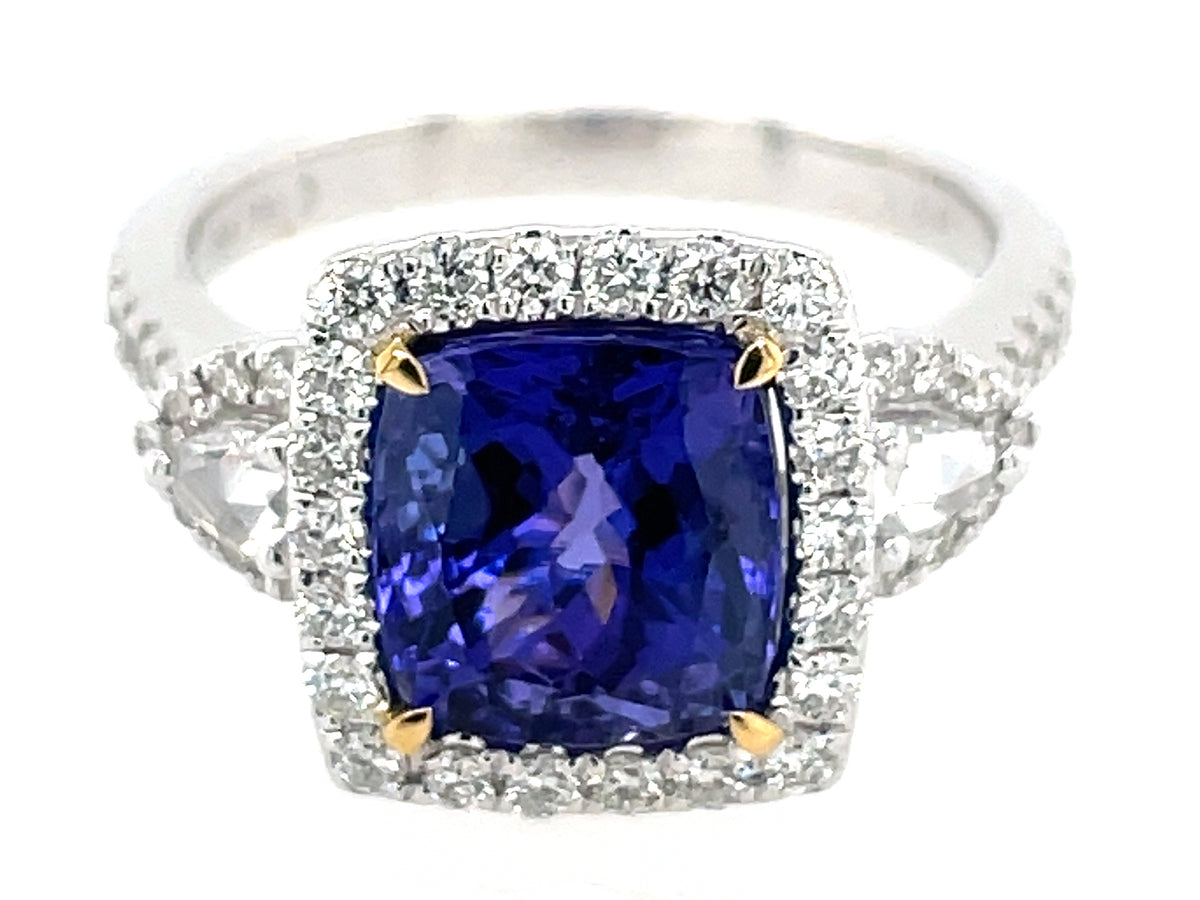 TANZANITE CUSHION & DIAMOND HALO 3 STONE RING