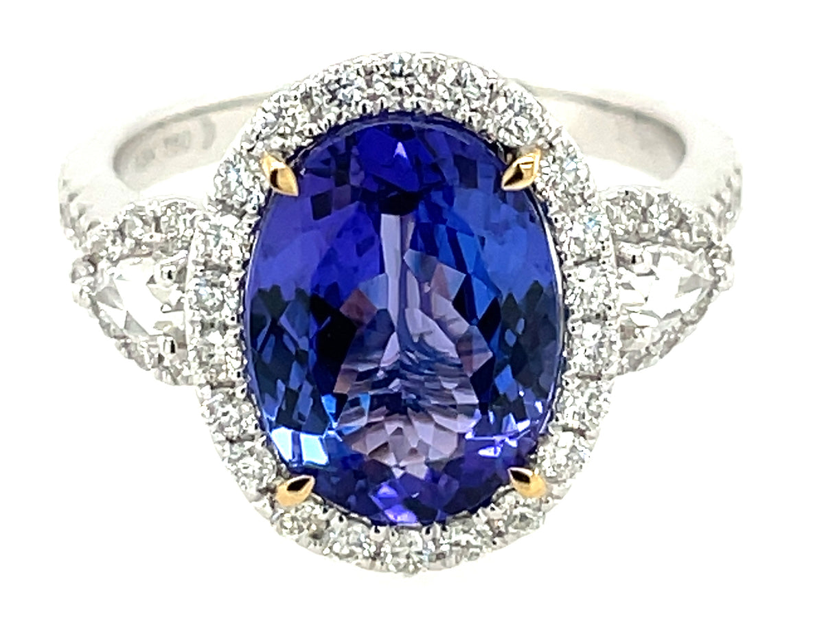 TANZANITE OVAL & DIAMOND HALO 3 STONE RING