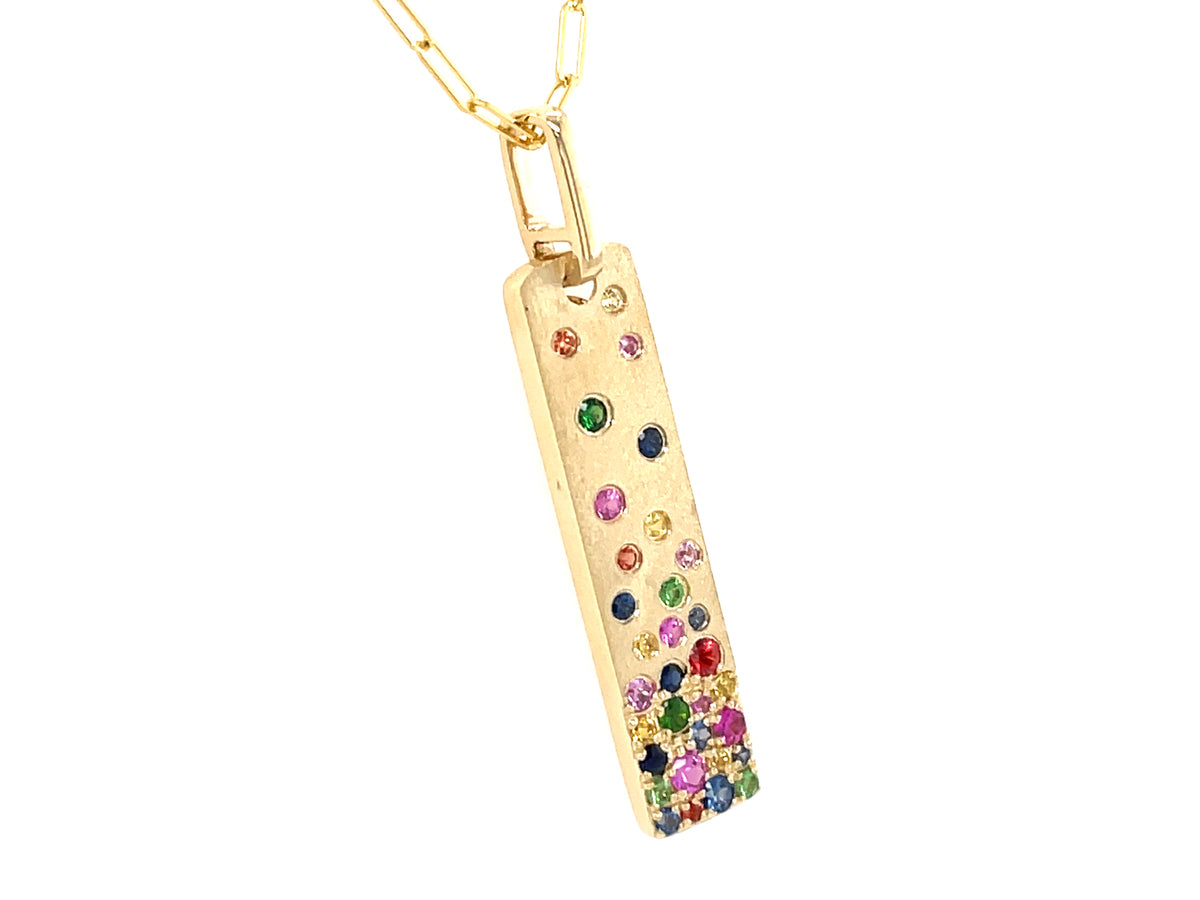 RAINBOW SAPPHIRE (H/U), TSAVORITE (N), RUBY (H) FLUSH SET VERTICAL BAR PENDANT, 30X7MM, 18" PAPERCLIP CHAIN, SATIN FINISH, 14KY