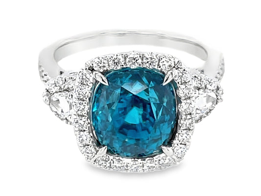 BLUE ZIRCON CUSHION & DIAMOND HALO 3 STONE RING, 18KW (H)
