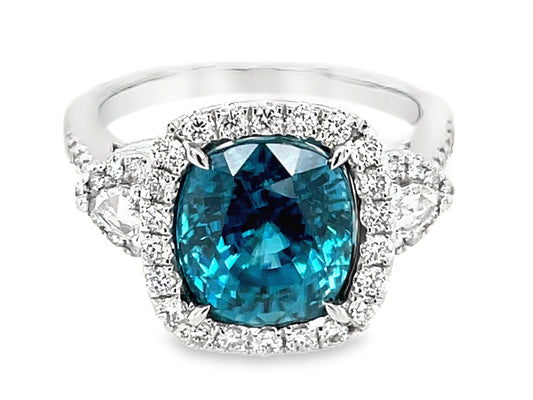 BLUE ZIRCON CUSHION & DIAMOND HALO 3 STONE RING, 18KW (H)