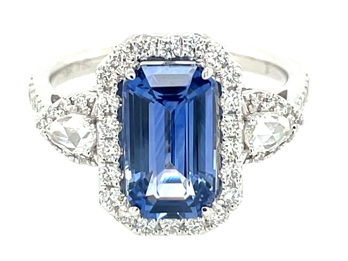 SAPPHIRE EMERALD CUT & DIAMOND 3 STONE HALO RING